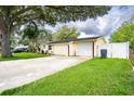 Single story home with attached garage and spacious yard at 4822 Melody Ln, Lakeland, FL 33805