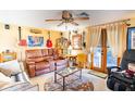 Cozy game room with leather seating, large screen TV, and musical instruments at 4822 Melody Ln, Lakeland, FL 33805