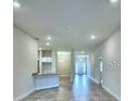 Bright and spacious living room with tile flooring and high ceilings at 1560 Leamington Lane, Winter Haven, FL 33884