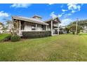 Home exterior with covered porch and well-maintained lawn at 29 Turtle Ln, Haines City, FL 33844