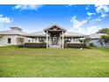 House exterior showcasing a metal roof and front porch at 29 Turtle Ln, Haines City, FL 33844