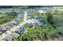 Aerial view of a house and surrounding neighborhood at 1011 Overlook Ct, Davenport, FL 33837