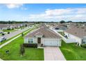 Aerial view of a single-story home in a residential area at 493 Burnham Cir, Auburndale, FL 33823