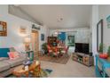 Beach-themed living room featuring a comfy couch and dining area at 4234 Cerimen St, Lake Wales, FL 33898
