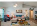 Bright living room with comfy seating, coastal decor, and a ceiling fan at 4234 Cerimen St, Lake Wales, FL 33898