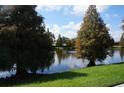 Serene lake view with lush trees at 3832 Traditions N Blvd, Winter Haven, FL 33884