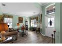 Spacious living room with green walls and wood floors at 3820 Traditions N Blvd, Winter Haven, FL 33884