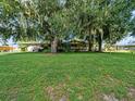 Ranch home with large yard and mature trees at 126 Bermuda Ct, Winter Haven, FL 33880