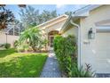 Single story home with two car garage and landscaped yard at 4189 Cannes Ave, Lake Wales, FL 33859