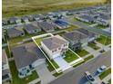 Aerial view of a two-story house in a residential neighborhood at 112 Sofia Ln, Lake Alfred, FL 33850