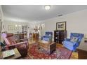 Spacious living room featuring hardwood floors and comfortable seating at 466 Muirfield Ct, Winter Haven, FL 33884