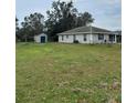 Large backyard with shed and open space at 720 S Morrison Ave, Fort Meade, FL 33841