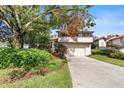 Two-story home with attached garage at 6001 Country Club Dr, Lake Wales, FL 33898