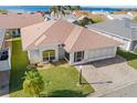 Aerial view of single-story home with landscaped yard and neighborhood at 627 Watercrest Dr, Haines City, FL 33844