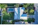 Aerial view showing house, pool, and surrounding area at 672 Wakulla Dr, Winter Haven, FL 33884