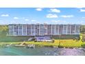 Condo building with lake access, pool, and tennis court at 700 Mirror Nw Ter # 508, Winter Haven, FL 33881