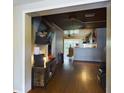 View through an archway showing the living room and kitchen at 3511 Avenue R Nw, Winter Haven, FL 33881