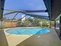 Relaxing screened-in pool area in backyard at 209 Santa Rosa Dr, Winter Haven, FL 33884