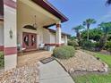 Welcoming front porch with double doors and tiled flooring at 209 Santa Rosa Dr, Winter Haven, FL 33884
