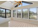 Bright breakfast nook with multiple windows and ceiling fan at 222 Okaloosa Dr, Winter Haven, FL 33884