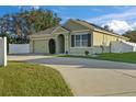 Single-Gathering house with a two-car garage and solar panels at 2304 Rose Blvd, Winter Haven, FL 33881