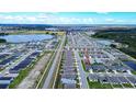 Aerial view of a single-Gathering home in a residential neighborhood at 1274 Zambrana Ct, Winter Haven, FL 33884