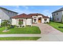 Luxury home with two-car garage and landscaping at 193 Stargrass Dr, Auburndale, FL 33823