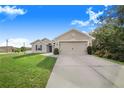 Attractive house with a two-car garage and neat lawn at 230 Grouper Ct, Poinciana, FL 34759