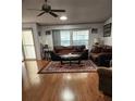 Bright and airy living room with hardwood floors and plenty of natural light at 312 Douglas Park Ave, Davenport, FL 33897