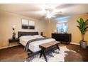 Main bedroom with comfy bed, dresser, and large window at 3121 Magnolia Dr, Indian Lake Estates, FL 33855