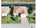 Single-Gathering home with canal-front access and brick driveway at 4152 Aberdeen Ln, Lake Wales, FL 33859