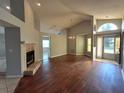 Bright and spacious living room with hardwood floors and a fireplace at 503 Little Lake Ct, Winter Haven, FL 33884