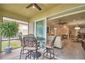 Bright and airy screened patio with table and chairs, offering views of the living room at 1644 Linz Ct, Winter Haven, FL 33884