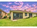 Relaxing screened patio with outdoor furniture and grill, perfect for entertaining at 1644 Linz Ct, Winter Haven, FL 33884