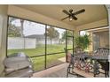 Spacious screened patio with seating area, grill, and backyard view at 1644 Linz Ct, Winter Haven, FL 33884