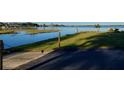 Peaceful waterfront view with grassy area and private boat access at 175 Bonnie Dr, Auburndale, FL 33823