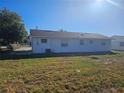 Back view of a house showcasing a large backyard at 2349 Lisa St, Lake Wales, FL 33898