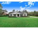 Single-story home with a white exterior and landscaping at 2997 Sequoyah Dr, Haines City, FL 33844