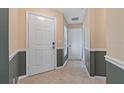 Bright entryway with neutral colors and tile flooring at 3309 Raleigh Dr, Winter Haven, FL 33884