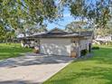 Two-car garage with a large driveway at 4570 Chambliss Rd, Winter Haven, FL 33884