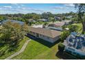 Aerial view of a ranch home and surrounding neighborhood at 501 Arneson Ave, Auburndale, FL 33823