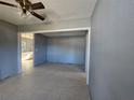 Open living area with tile floors and access to kitchen at 102 Luna Rd, Auburndale, FL 33823