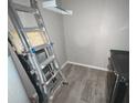 Unfinished basement area with a ladder and tiled floor at 1082 Sunshine Sw Way, Winter Haven, FL 33880