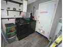 Laundry room with washer, dryer, and shelving at 1082 Sunshine Sw Way, Winter Haven, FL 33880