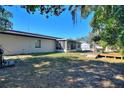 Large backyard with screened patio, deck, and above-ground pool at 1610 Meadow Ne Ln, Winter Haven, FL 33881
