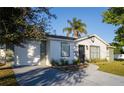 Updated single story home with fresh landscaping and driveway at 315 Lauderdale Ct, Kissimmee, FL 34759