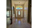 Bright and spacious foyer with tile flooring and a chandelier at 1072 Old Cutler Rd, Lake Wales, FL 33898