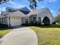 Two-story house with a gray exterior and attached garage at 3155 Stonewater Dr # 3155, Lakeland, FL 33803