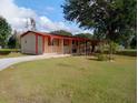 Single-story home with a carport and spacious yard at 4022 Carter Ct, Polk City, FL 33868