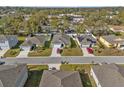 Drone view of houses on a tree-lined street at 4956 Jackson St, Winter Haven, FL 33884